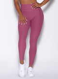 Zoomed in front view of a model in our Chevron Leggings in Rose Wine color