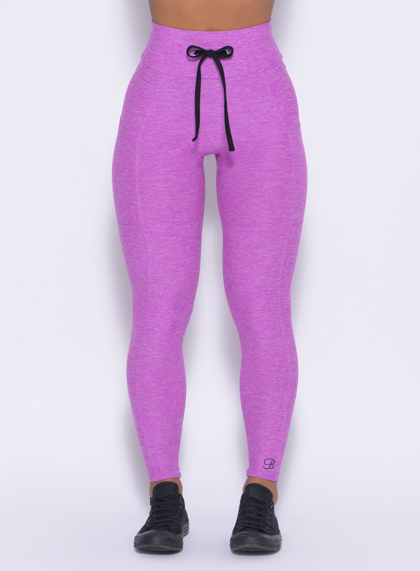 Zoomed in  front view of  our purple thrive leggings 