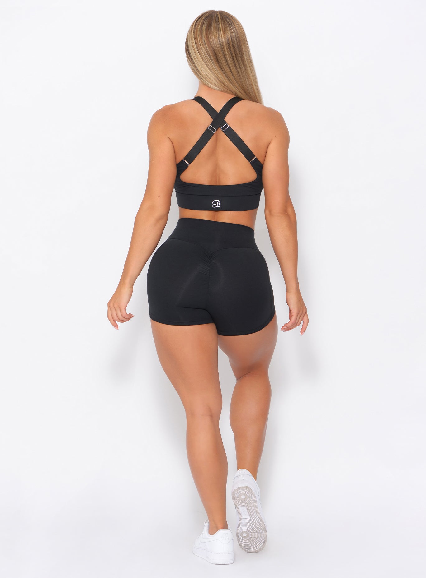 Sculpting back profile of black Curves Shorts with a high-rise fit for high-performance training.