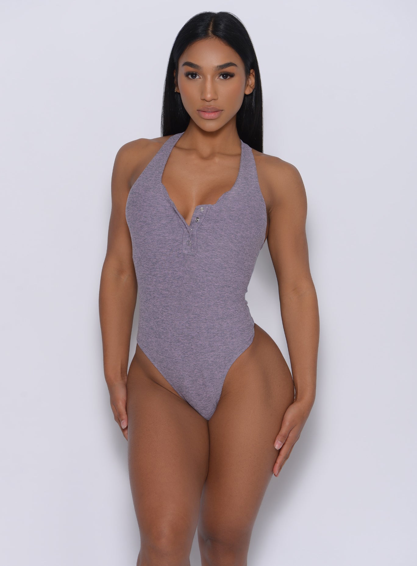 Front profile view of a model in our perfect bodysuit in orchid color