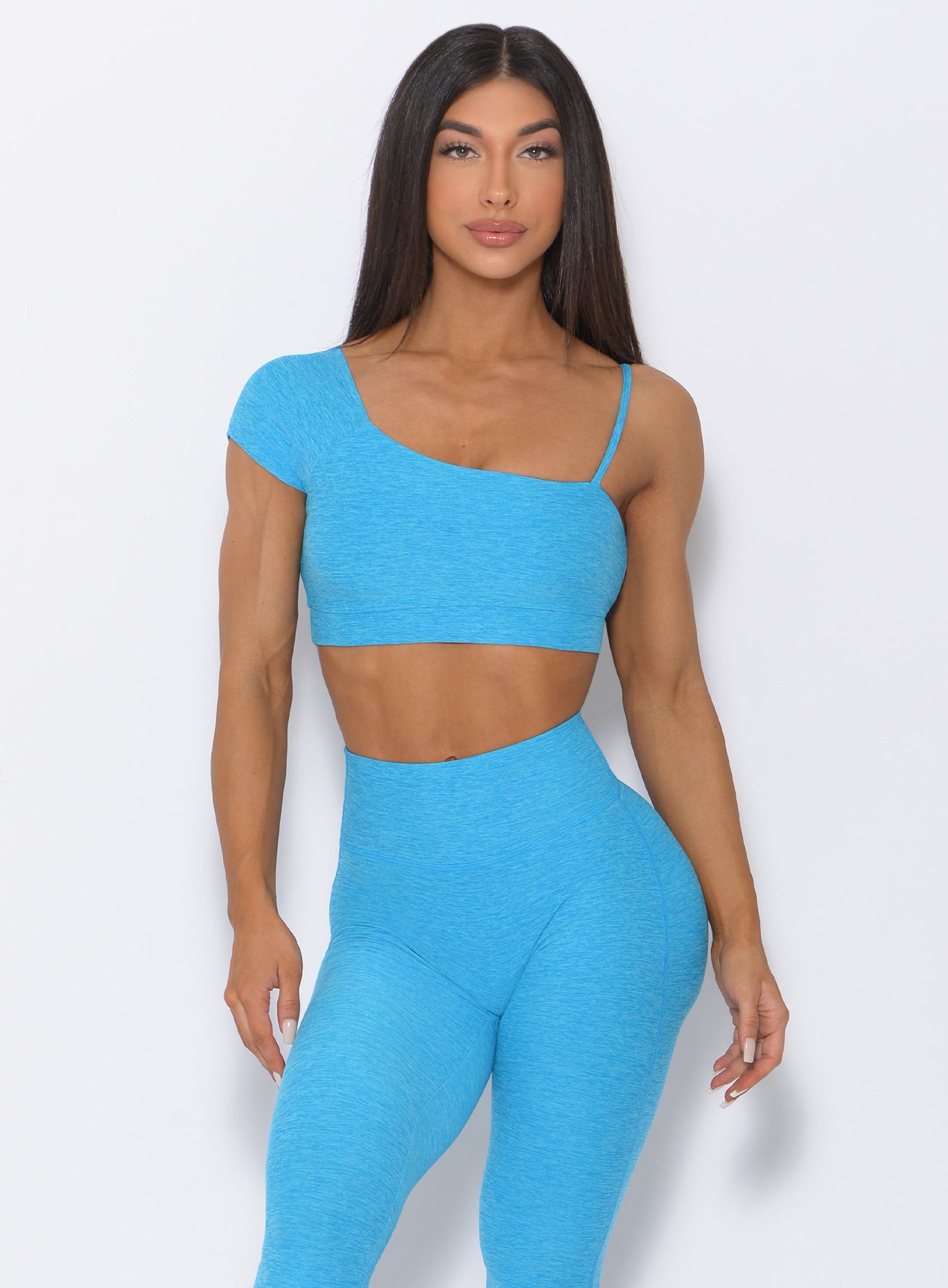 Model facing forward in our Adore Sports Bra in icy blue and a matching leggings