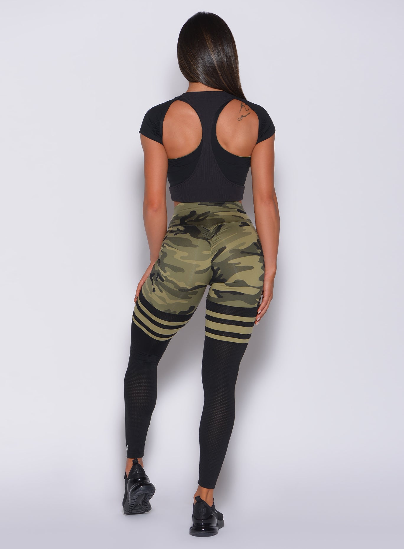 Sculpting green camo Scrunch Thigh-Highs with breathable mesh and a supportive high waist.