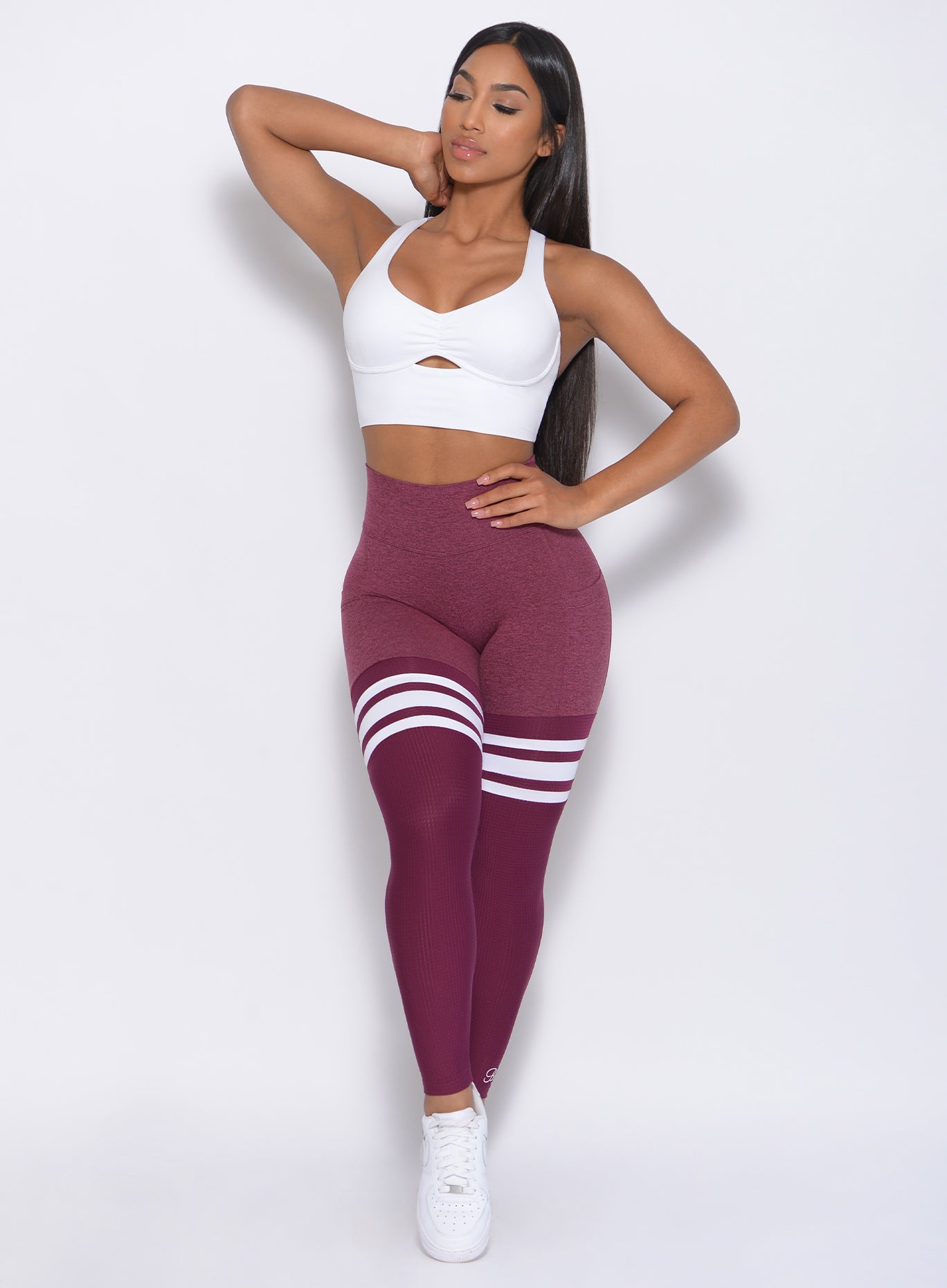 Full front view of the model wearing our white Bralette and a high waist leggings in Burgundy Rose