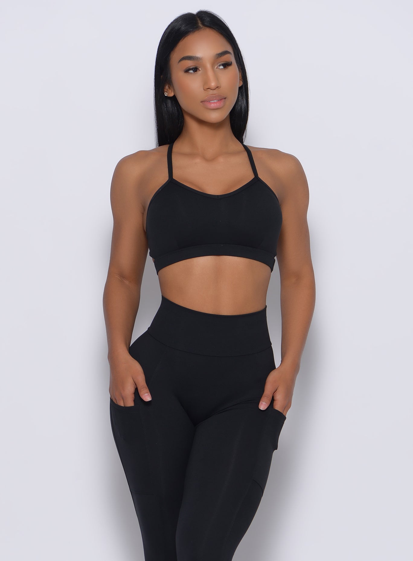 Black Pumped Sports Bra with adjustable straps and molded cups for high-impact gym support.