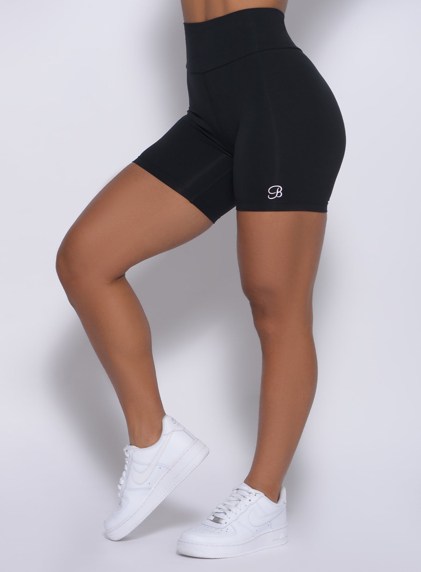 Zoomed in left side view of our black refined shorts 