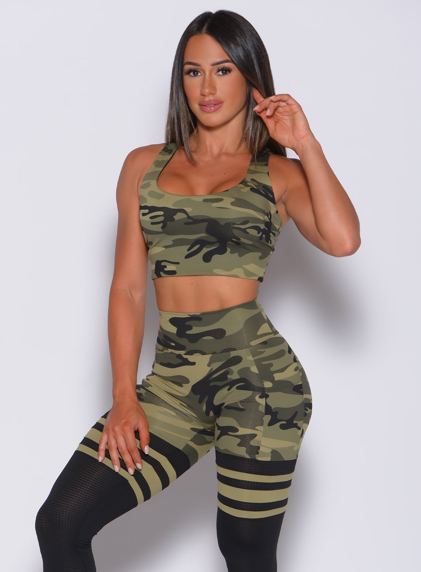 Green camo Reversible Tank Bra with a racerback cut and second-skin fit for yoga sessions.