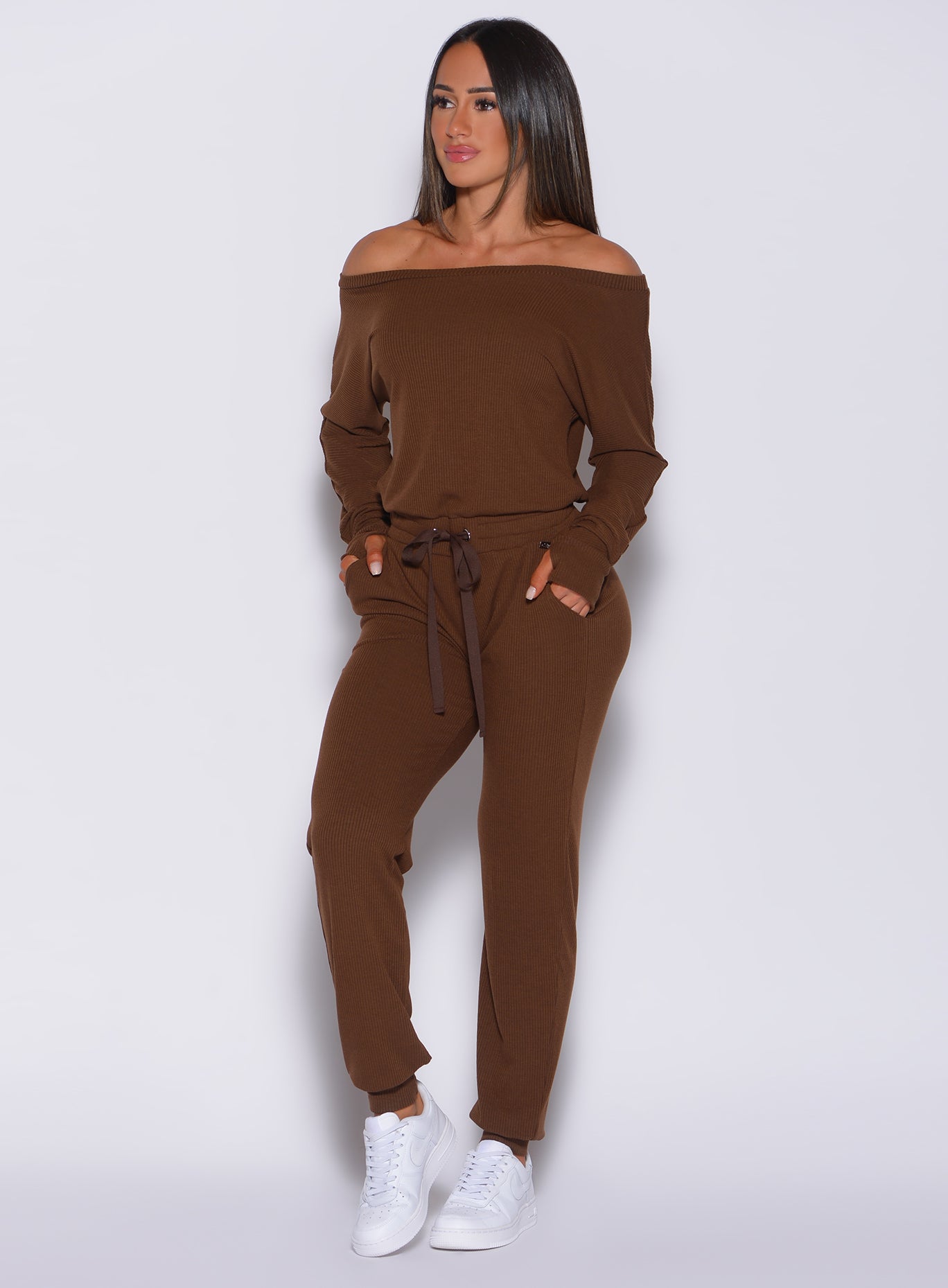 Model facing forward wearing our rib jumpsuit in expresso color 