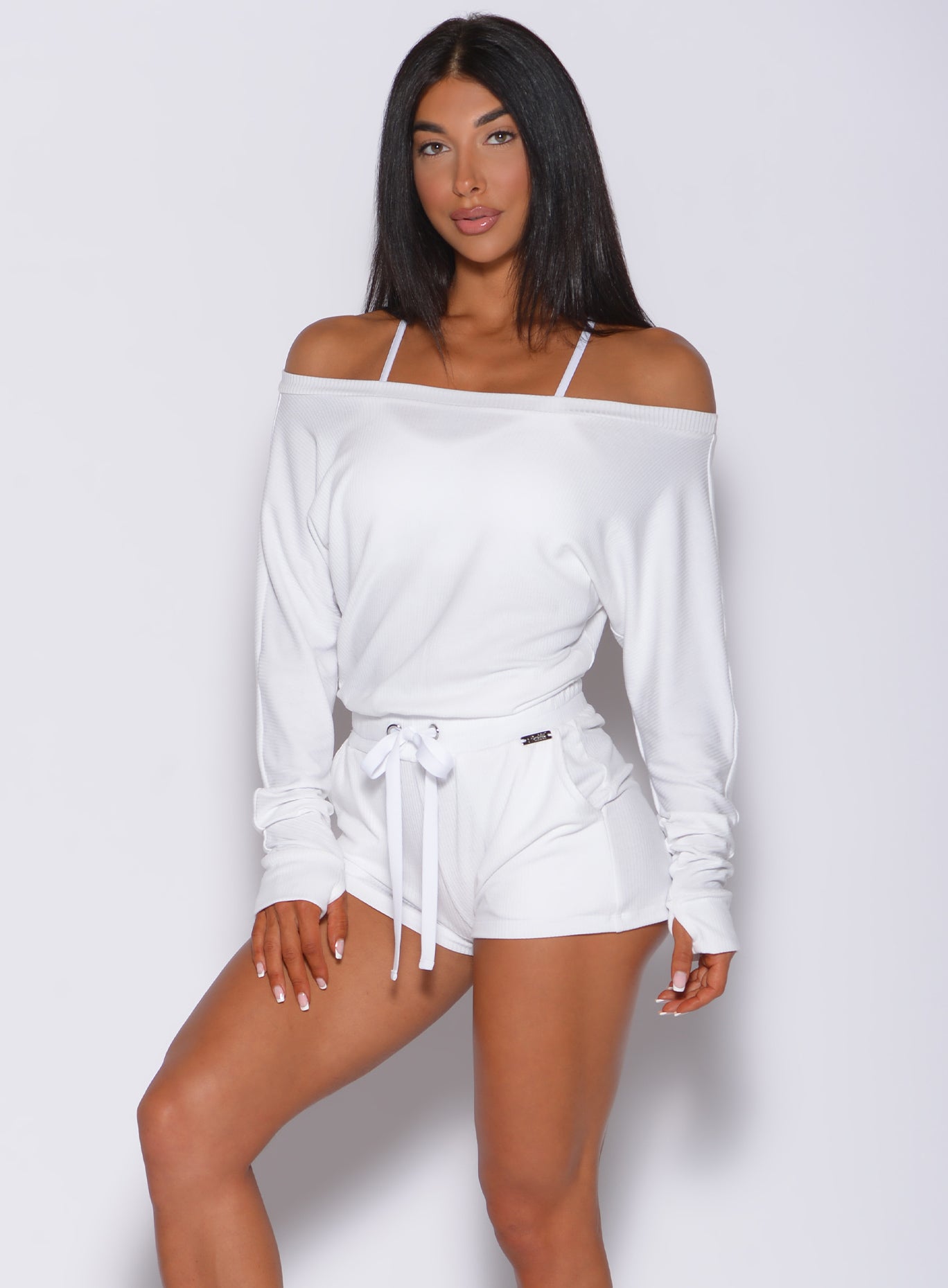 Model facing forward wearing our white romper