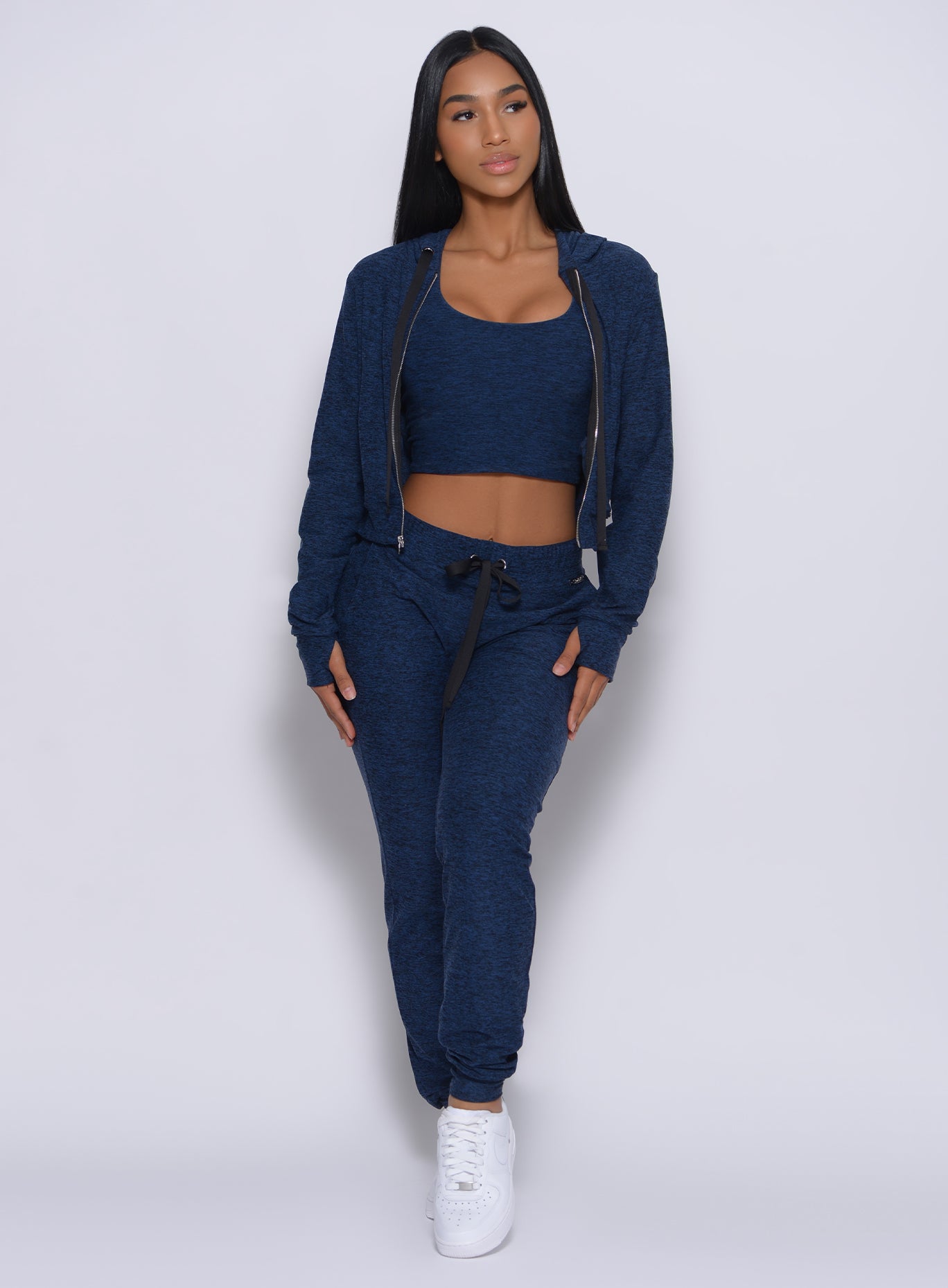 Model facing forward wearing our signature joggers in sapphire blue color and a matching jacket