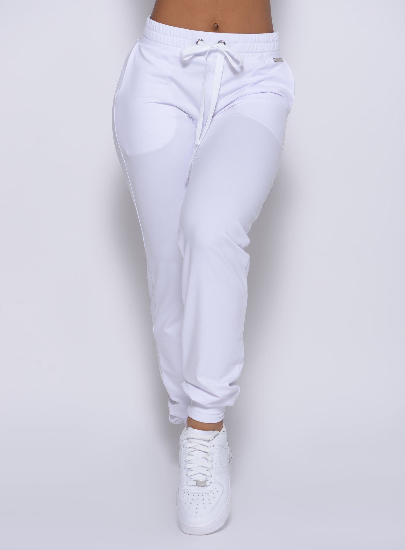 Zoomed in front view of our white signature joggers 
