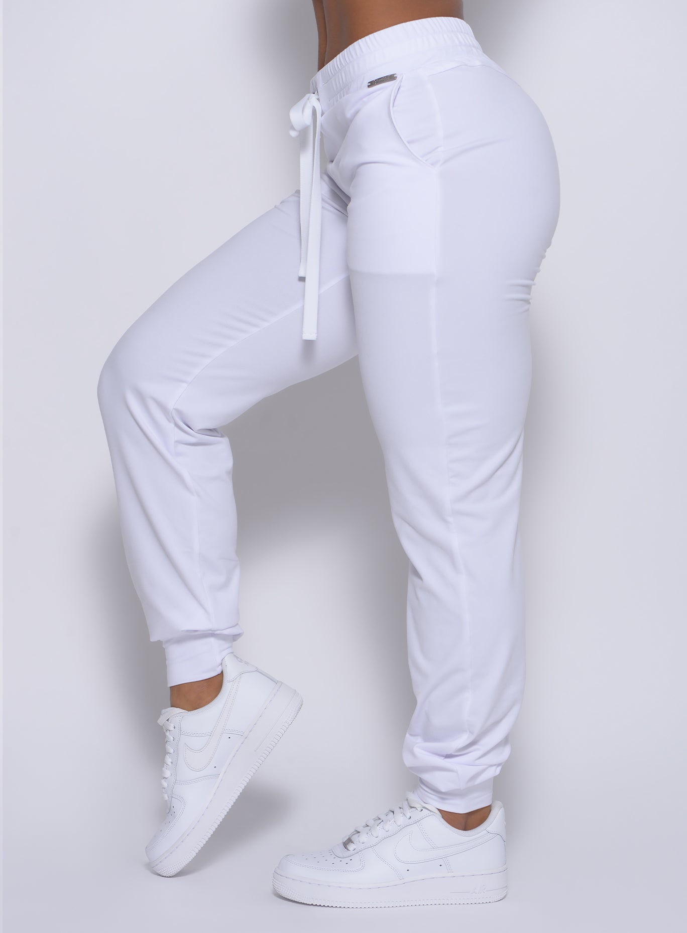 Zoomed in left side view of our white signature joggers 