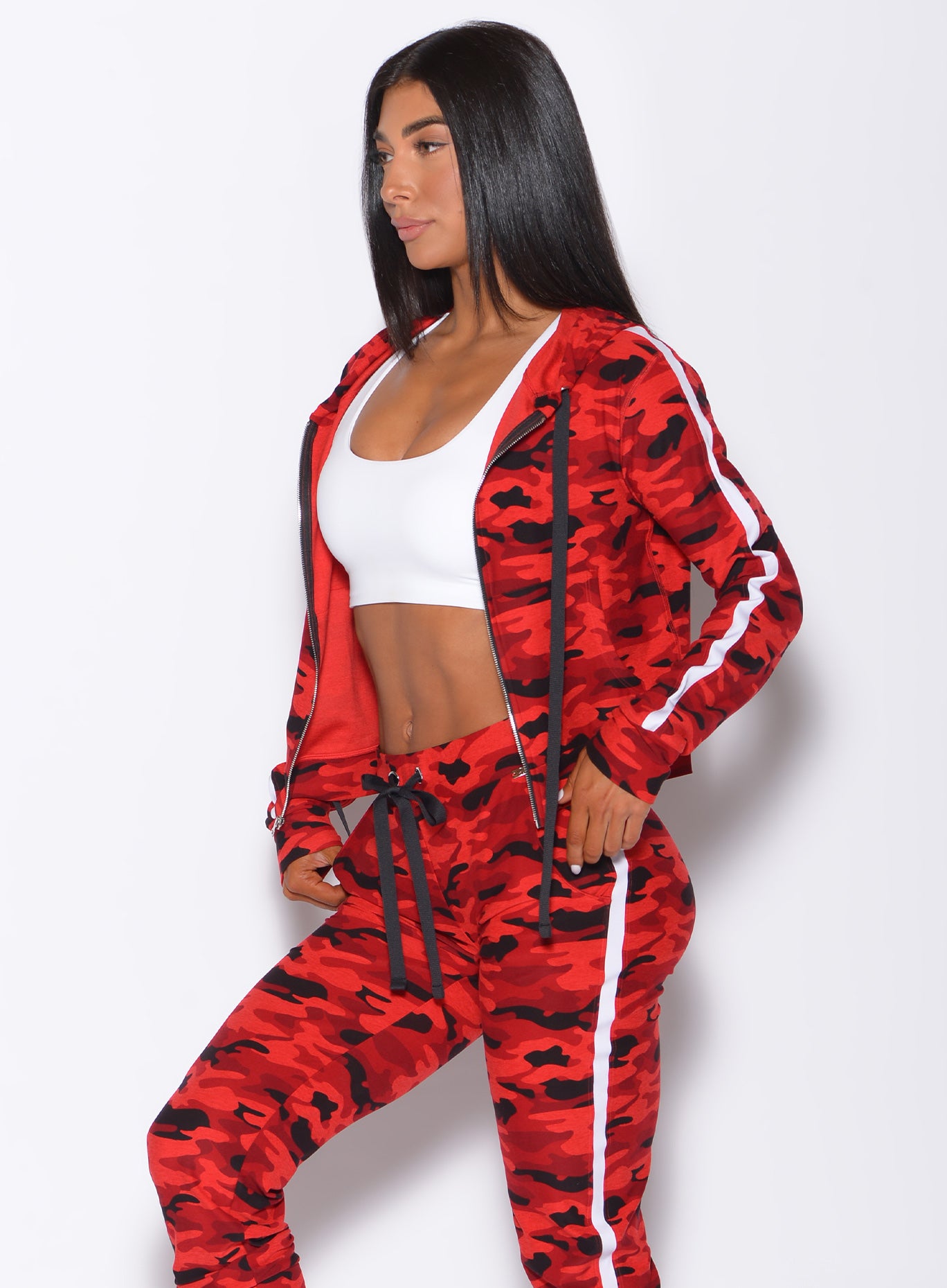 Left side profile view of a model in our dream jacket in Red Rebel Camo color and a matching joggers 