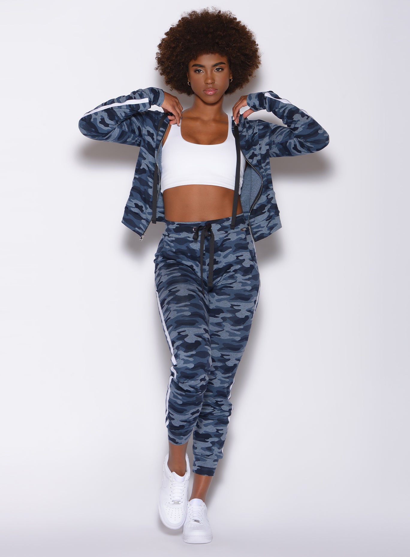 Front profile view of a model wearing our dream joggers in Blue Blast Camo color and a matching jacket