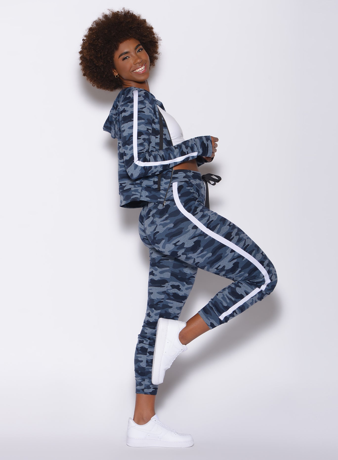 Right profile view of a model wearing our dream joggers in Blue Blast Camo color and a matching jacket