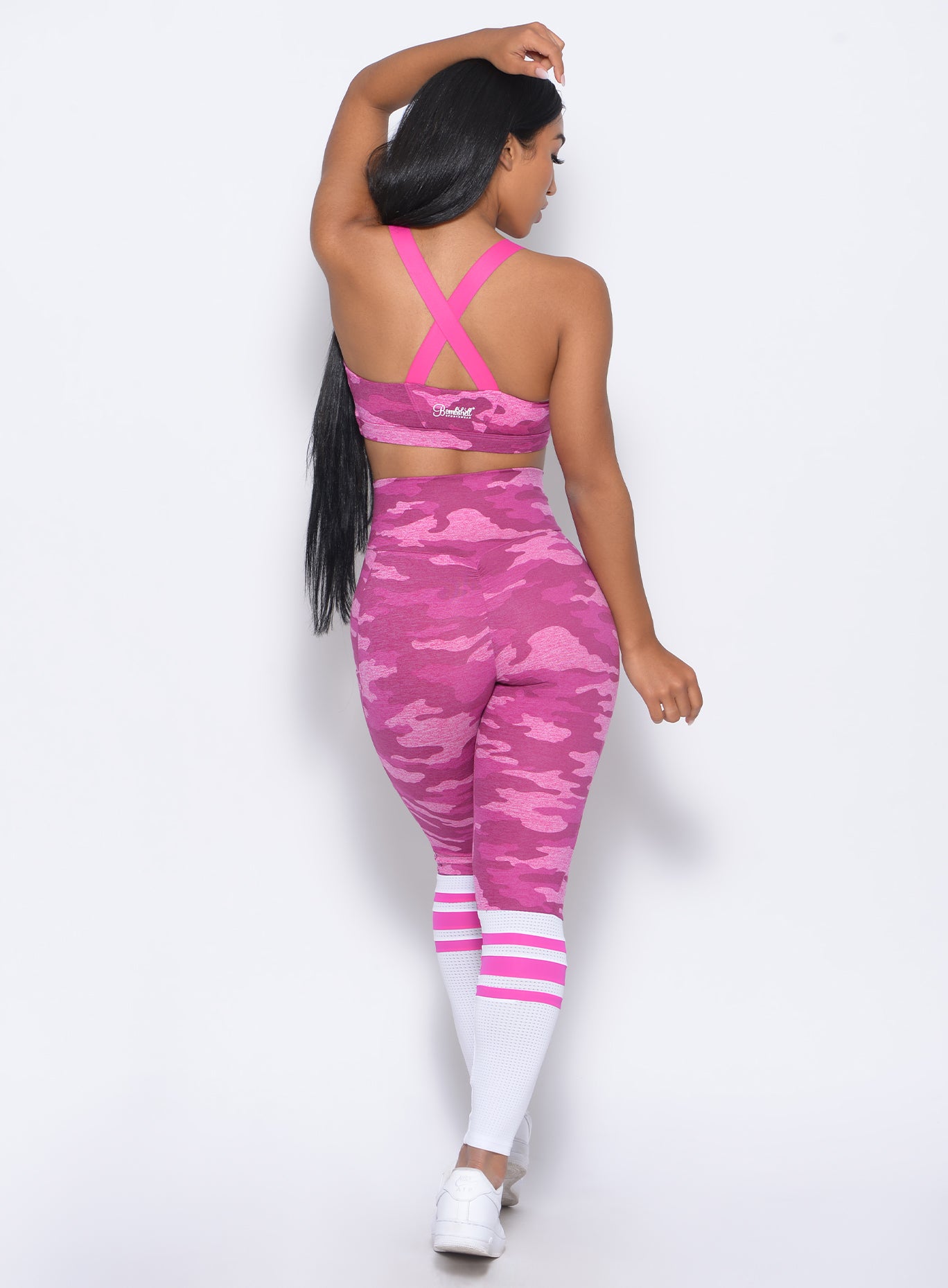 Back  view of the model in our contour sock leggings in pink camo and a matching bra