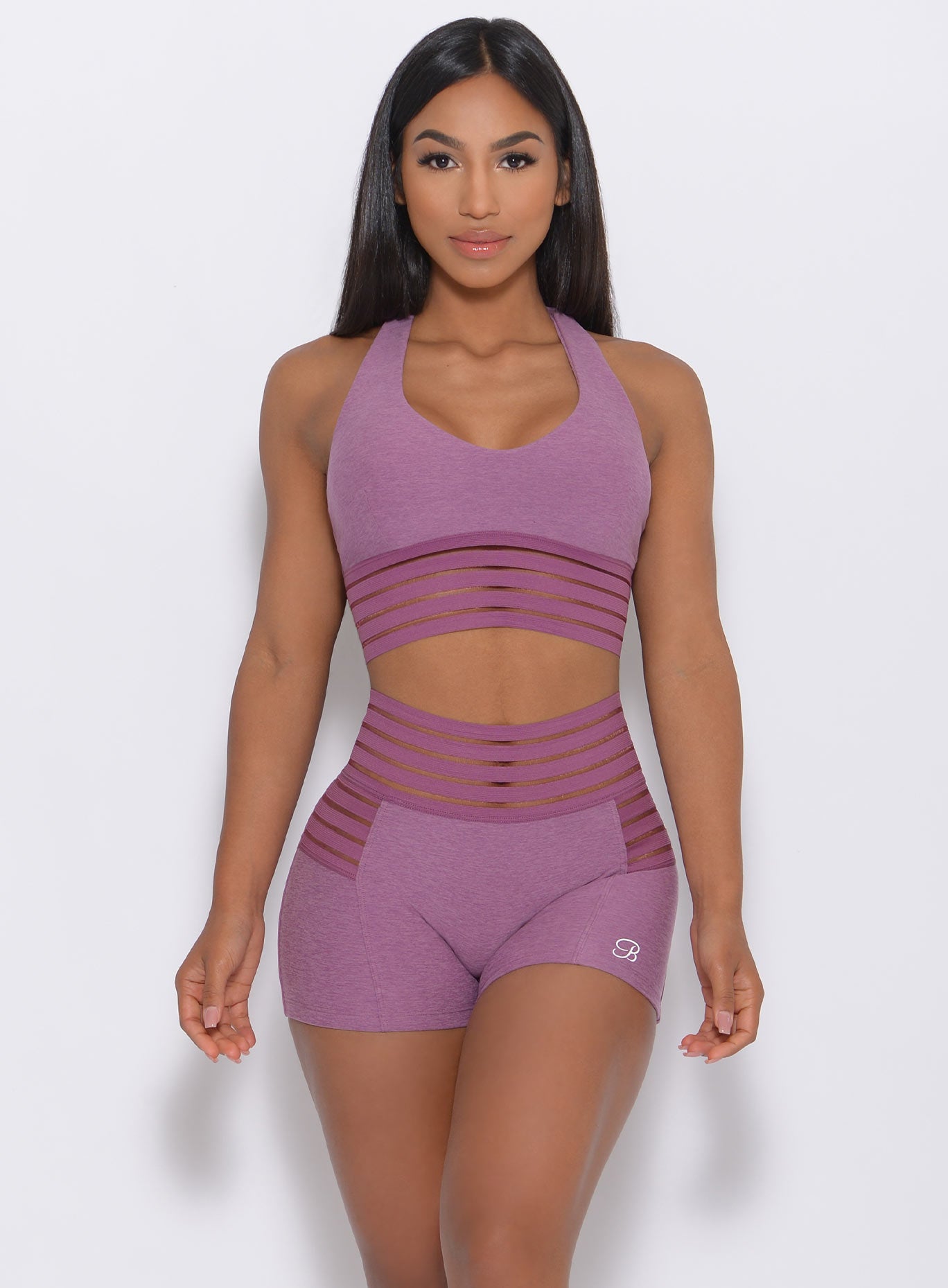 Model facing forward in our statement sports bra in lavender color and a matching shorts