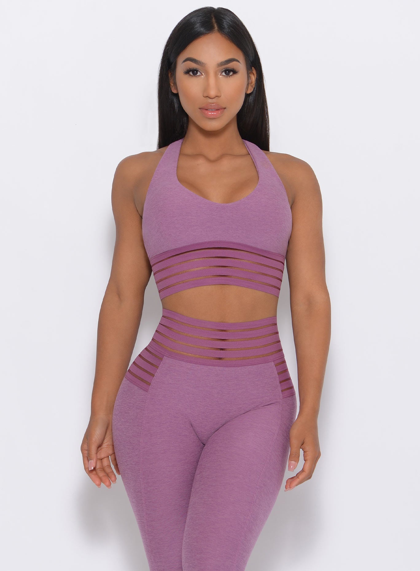 Front view of the model wearing our statement sports bra in lavender color and a matching shorts
