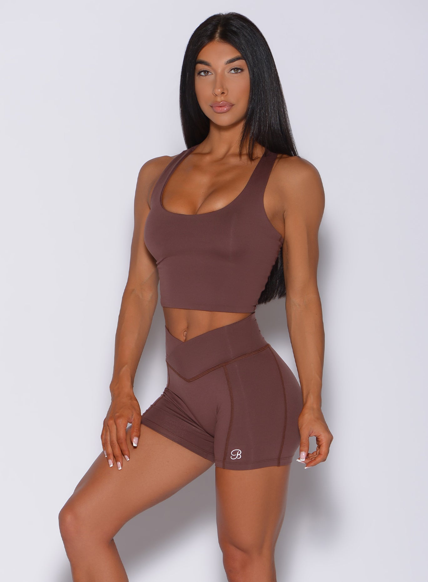 Front profile view of a model in our ultimate tank bra in chocolate color and a matching shorts 