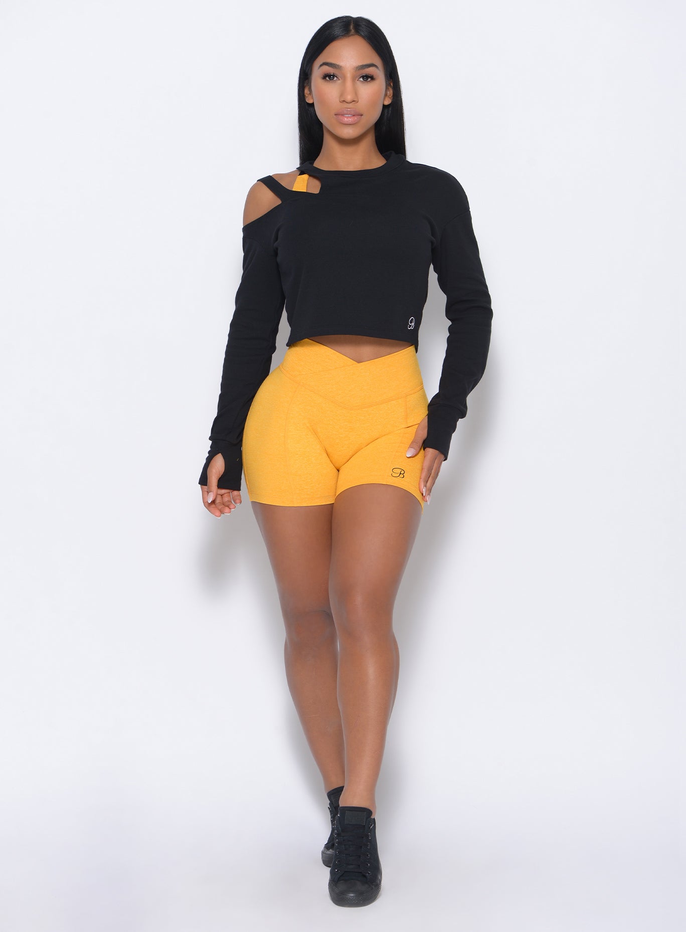 Sunkissed Tiny Waist Shorts with a V-cut waistband and scrunch booty for a sculpted gym look.