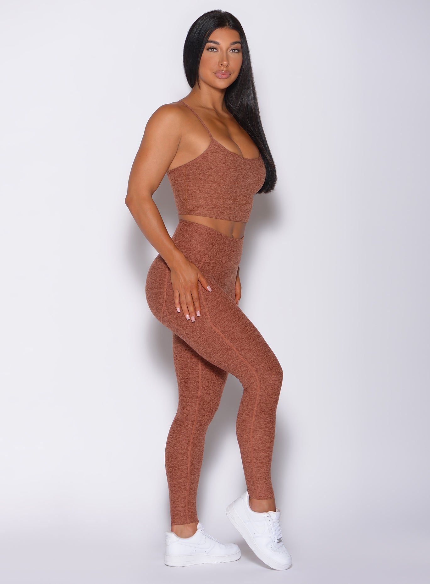 Right side profile view of a model wearing our relax long bra in spiced chai color and a matching leggings