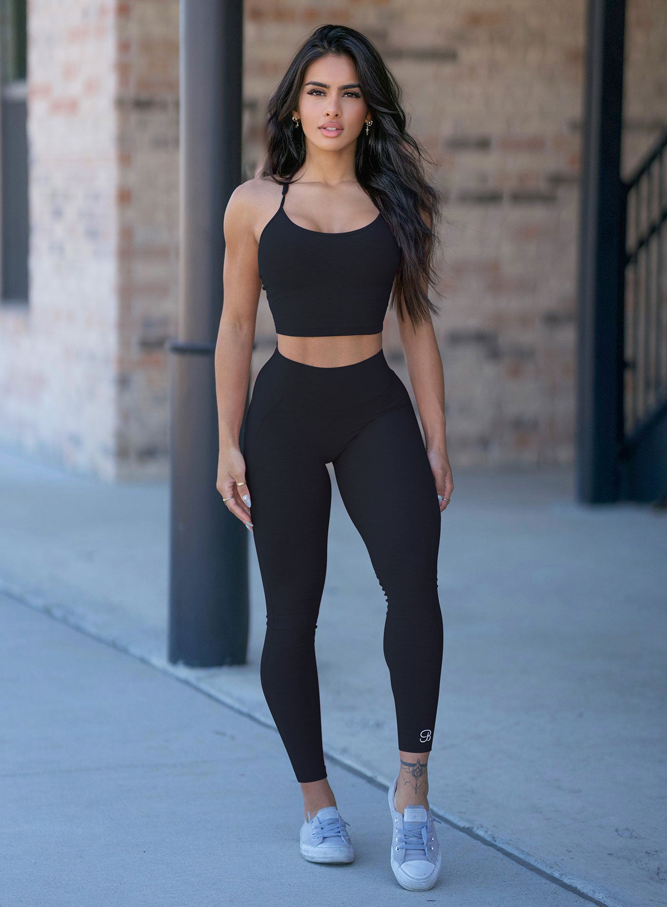 Black high-waisted Uplift Leggings featuring a sculpting compression fit for leg day.