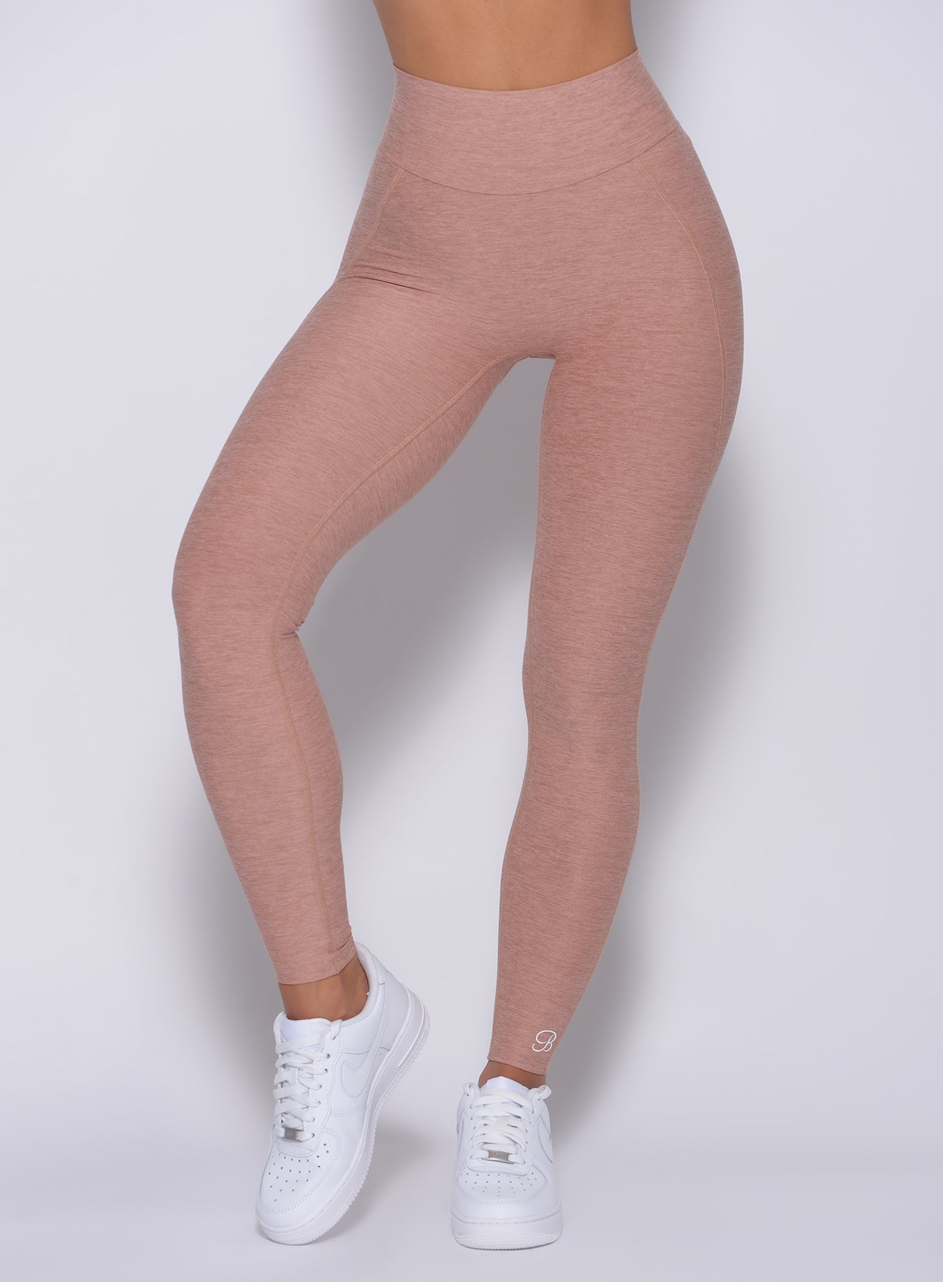 Zoomed in front view of our uplift leggings in latte color 