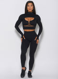 Full front profile view of the model wearing the black pullover