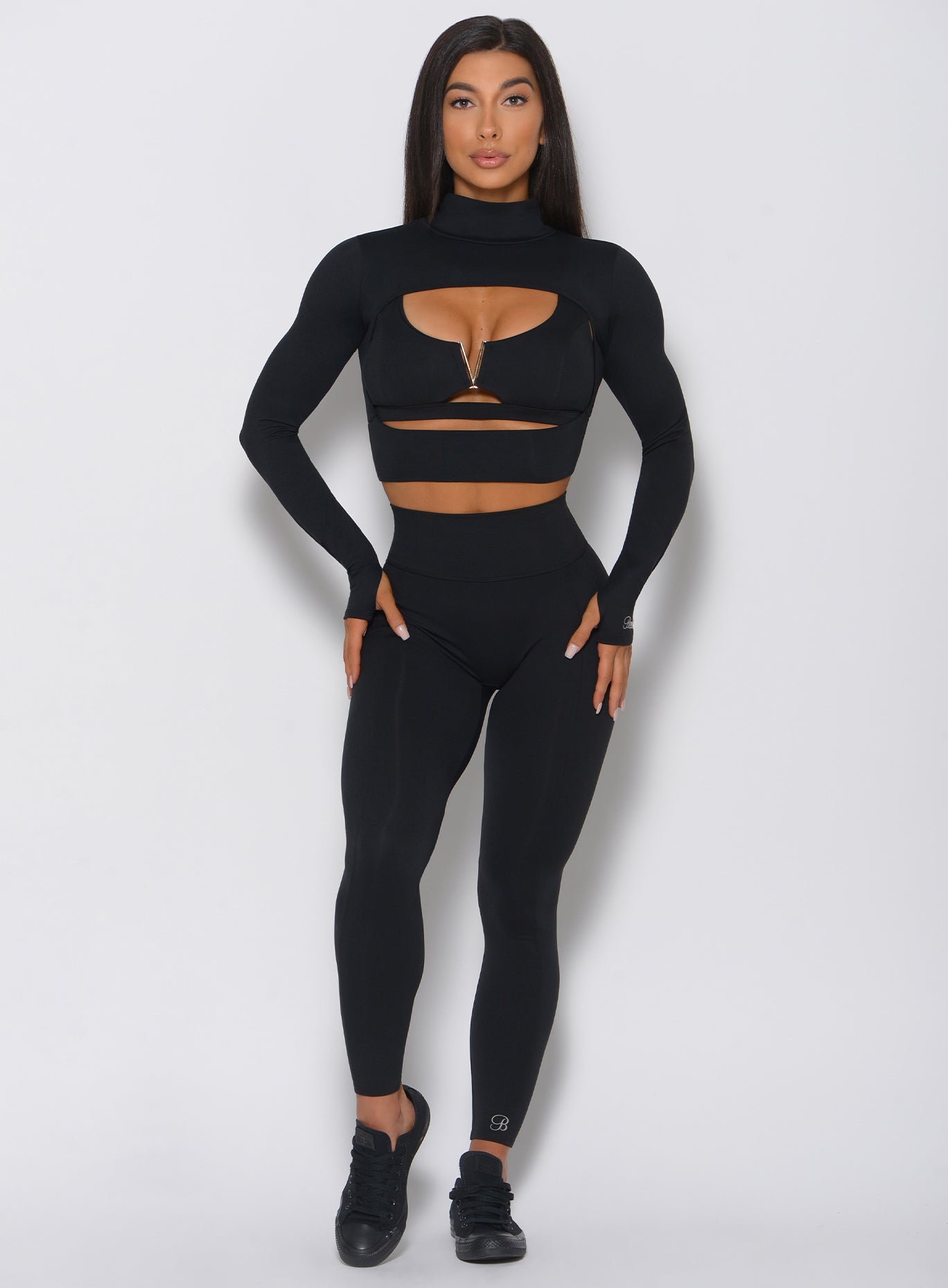 Black Victory Leggings with sculpting V-back seams and a supportive high-waisted fit.