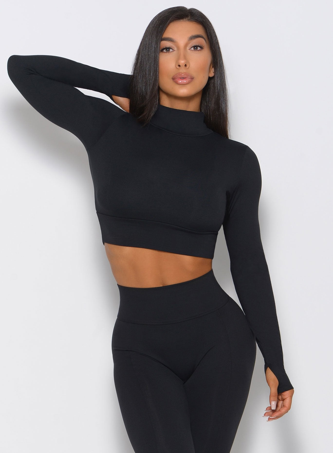 Black Combo Pullover featuring a breathable cropped fit and thumbholes for effortless gym style.